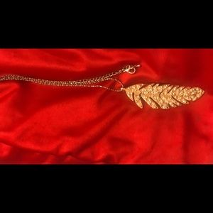 Gold feather necklace with gems